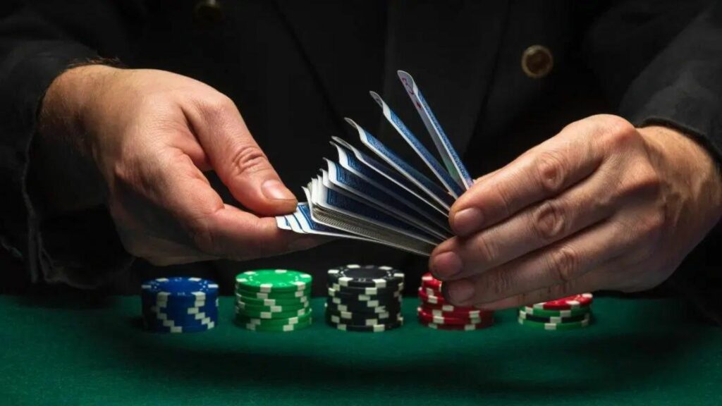 A Man Holding Poker Cards